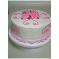 Pink Practice Cake I made this cake for my family, so I thought I might as well make it pretty. Still working on those roses! Used my design press on the top...