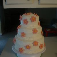 Dsc01666.jpg My first attempt at "ironing" butter cream icing & making gum paste flowers.