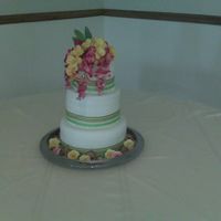 Brittany's Wedding Cake My first wedding cake that I made for my daughter wedding. MMF, flowers and shell around cake are gumpaste, silk flowers as topper, ribbon...