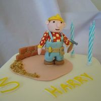 Bob The Builder I made this vanilla sponge cake for a little boy who is mad on the cartoon 'Bob the Builder'I made the model and the brick wall...