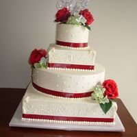 Roses And Bling Monogram topper made entirely by me. Carrot cake top tier, amaretto "marzipan" bottom tiers, filled with white chocolate cream...