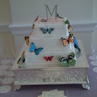 Christie And Jose's Wedding Cake This was my first wedding cake. It was for two of my co-workers. It was a strawberry cake with all buttercream frosting.