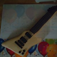 Guitar Birthday Cake This is a replica of my husbands first guitar when he was in high school.