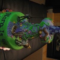 Tangled Tower Cake 10" round base covered with fondant. Rice Treat Tower with fondant accents.