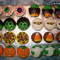 Halloween Cupcakes White cupcakes with various Halloween theme decorations. All buttercream. I made eyeballs, cauldrons, draculas, mummies, spiderwebs, candy...