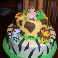 Jungle Baby All the figures are fondant.. The cake are lemon w/lemon filling and BC icing..