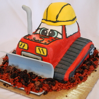 Dozer This is a white cake with BC and fondant details.. I carved the structure by hand out of a square cake and a bread pan..