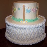 My Clothesline Interpretation My first attempt at a clothesline cake, got the inspiration from wilton and chleonard. 6 and 10 inch, fondant clothes and poles, gumpaste...