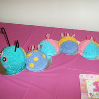 Caterpiller Cake I made this for my daughter's first birthday. It's white cake colored pink for the head, the next two sections are confetti cake...
