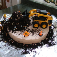 Construction Cake This is the cake I made for my husband's birthday. He works commercial construction and always asks me to buy him a skid steer. :)