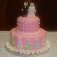 Bridal Shower Pink Wedding Cakes This was so much fun. I loved decorating the mini wedding cakes around the bottom layer. I got this idea from a Wilton book.