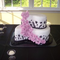 Black & White Paisley Bridal Shower Cake This was my first time using the paisley pan set. I made this cake for a bridal shower. I think it turned out cute but piping the black...