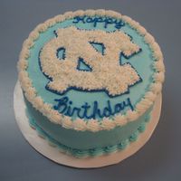 Unc 8" round, 3 layer marble cake with custard filling and buttercream frosting.