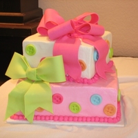 Buttons And Bows Button and Bow Baby shower cake. Bows are gumpaste, buttons are fondant.