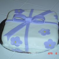 First Time With Fondant Course 3 Class 2 my "present" cake with fondant. The bows are actually purple but the photo makes them look blue.