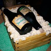 Wine Crate Wooden crate with two bottles of wine. Sculpted bottles covered with fondant. Wooden crate created with slates of fondant and hand painted...