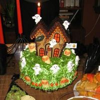 Halloween Haunted House Haunted Gingerbread house topping a Halloween garden visited by not-so-scary ghosts.