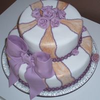 Gold & Purple 50Th Anniversary Anniversary cake for a friends parents. All fondant, painted withh gold lustre dust (doesn't really show on the photo) and RI borders...