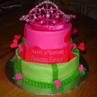 Princess Birthday Two tier white cake with buttercream icing, fondant hearts, and a purchased crown