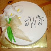 Calla Lilly Bridal Shower Two-layer, half white half chocolate cake with buittercream icing. Calla lillies made from tinted fondant.