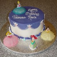 Disney Princess Cake 8" White cake with strawberry filling and buttercream icing. Friend's daughter wanted 4 princesses on her cake since she is...