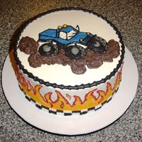 Monster Truck 10" chocolate cake with oreo filling and buttercream icing. Flames and truck hand painted.