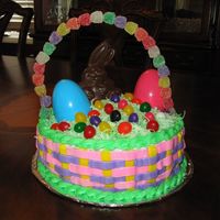 Easter Basket Cake I made this for my niece/nephew as their easter basket. I used the basket weave technique, colored coconut for the grass, used jelly beans...