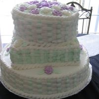 Flower Basket Cake This was my first 3-tier cake. It was made with 3 different flavors of cake and buttercream icing. The roses are part royal part...