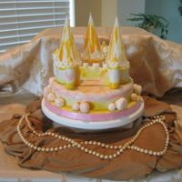 Picture_089.jpg I made this for my inlaws daughter. The bottom cake and 3 mini castles are a Madeira cake, the bolders are made of sugarpaste. On the 3...