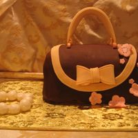 Picture_203.jpg This was inspired by "The Confetti Cakes" cookbook, and the chocolate rolled fondant was inspired by "The Cake Bible"