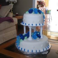 My First Wedding Cake For Course 3 This is my first wedding cake we did in our course 3. Its all fondant with 38 different shades of blue fondant roses. FeWf! it's...
