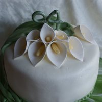 Cala Lily Birthday A double layer 10 inch white cake covered with vanilla butter cream than home made fondant icings. The calla lilies and the number 94 are...