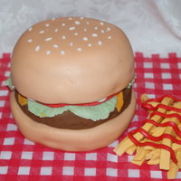 Hamburger & Fries Hamburger & Fries - This cake is a triple layer chocolate cake filled and covered with vanilla butter cream and home made fondant. The...
