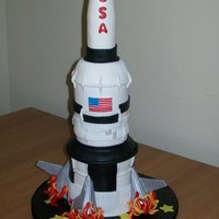 Blast Off My first rocket cake! Oh, how we learn on our firsts! Can't wait to do another and improve it! 4 and 3" stacked and carved....