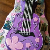 Taylor Swift Inspired Guitar Cake The birthday girl LOVES Taylor Swift. She also LOVES purple.....so this is what we came up with! Covered in buttercream with fondant...