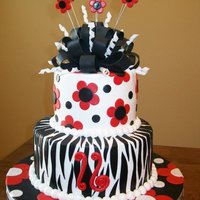 Black And Red Sweet 16! Fun cake for a darling girl turning 16! Covered in buttercream with fondant accents! TFL! Still need to ribbon the board...LOL!