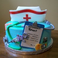 Graduation From Nursing School Quick little cake made for a friend who just graduated nursing school. Covered in buttercream with fondant accents!
