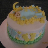 Baby Sleeping In The Clouds. I made this for my girlfriends baby shower, she knew it would be a boy. I used fondant and buttercream icing, couldnt get the clouds white...