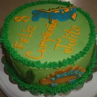 Dinosaurs Ponque with buttercream and fondant accents. This was for my nephew's bday.