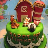 Farm Cake I made this cake for my nephew's first birthday. It had a gumpaste barn, silo and various farm animals.