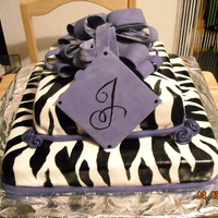 Julie's Zebra Cake Non filled Funfetti cake, covered in MMF, Hand painted zebra stripes, 5050 mix of MMF and gumpaste for purple bow - my first attempt - did...