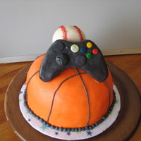 Sports Themed Cakes Cake for teen boy. I was told he likes basketball, baseball and video games. With some inspiration on this site, came up with this. The...