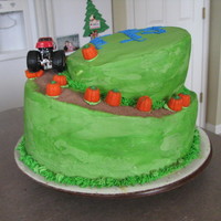 Boys Topsy Turvy This was my first attempt at a topsy turvy. All BC frosting. The dirt was hot cocoa mix. Truck is matchbox.