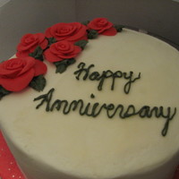 Fondant Roses Anniversary cake. Chocolate cake with caramel creme filling. BC frosting and fondant roses. This was my first attempt at fondant roses.