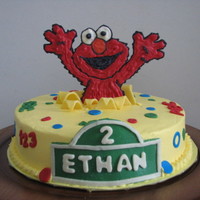 Elmo Cake This is a 2nd birthday cake for my friends' son. Frosted with BC, accent pieces are all candy clay and the Elmo is a choc transfer....
