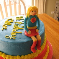 Super Girl Cake For my DD birthday. Super girl is made from candy clay. Frosted in BC.