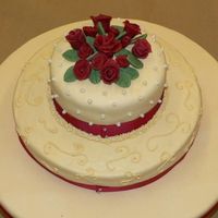 Wilton Class Iii Final Cake MMF cover dummy, the main cake layer is french vanilla with raspberry, mmf and free hand scrolls, top is butter yellow and creme de menthe...