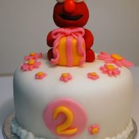 Elmo Mini Cake This was an Elmo mini cake that I made for a little girl turning 2. I also made matching Elmo cupcakes for her party guests. The little...