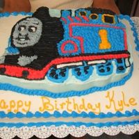 Thomas The Train A thomas cake (wilton Pan) on top of a half sheet cake. All vanilla withbc icing. made for for cousins sons birthday. i dont really dont...
