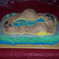 Dirt Bike Birthday Cake This cake was fun to do. The hills were made with different size cupcakes.